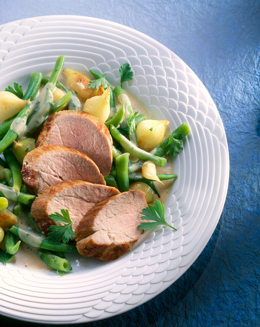 Beans with pork on plate