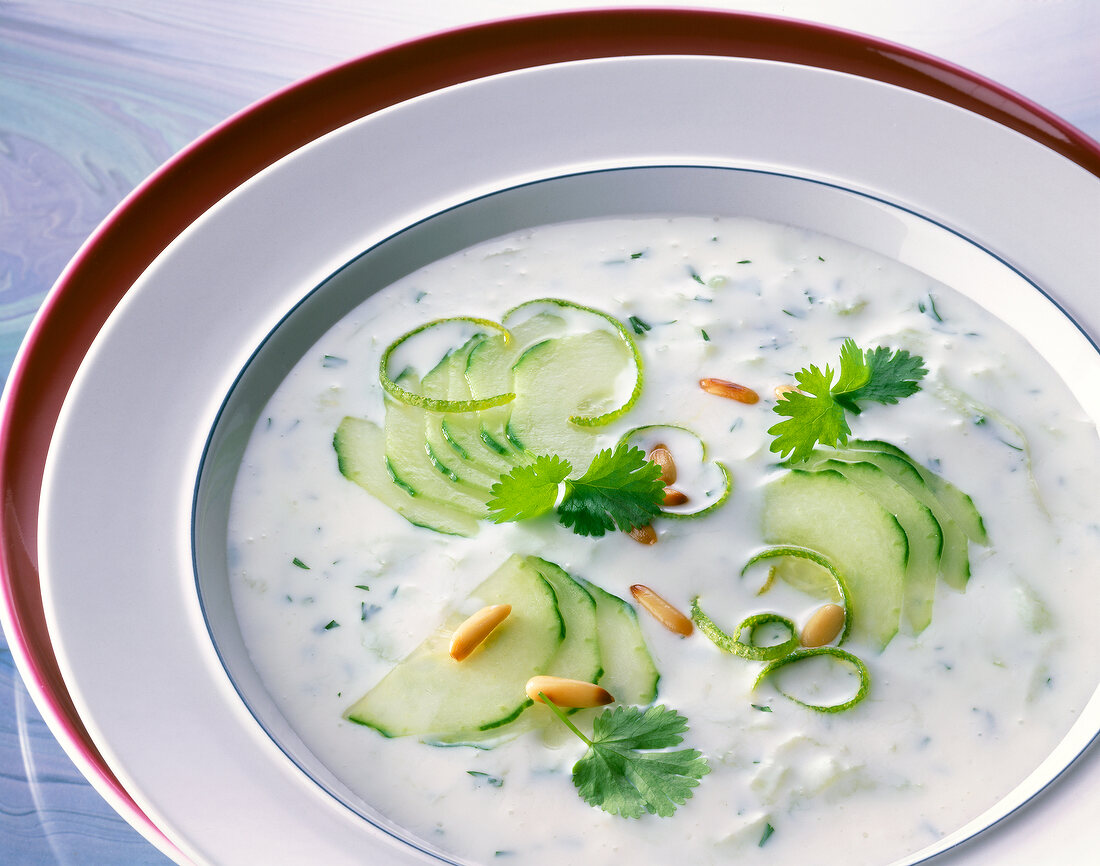 Cold soup made with cucumber and kefir in bowl