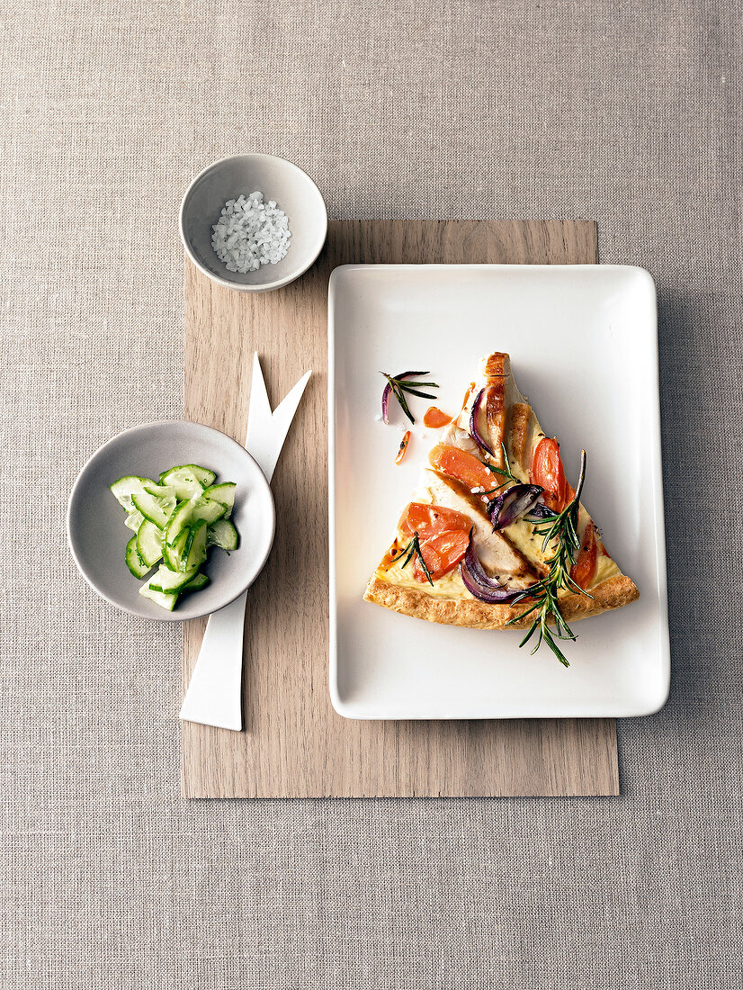 Piece of carrot chicken quiche on plate, overhead view