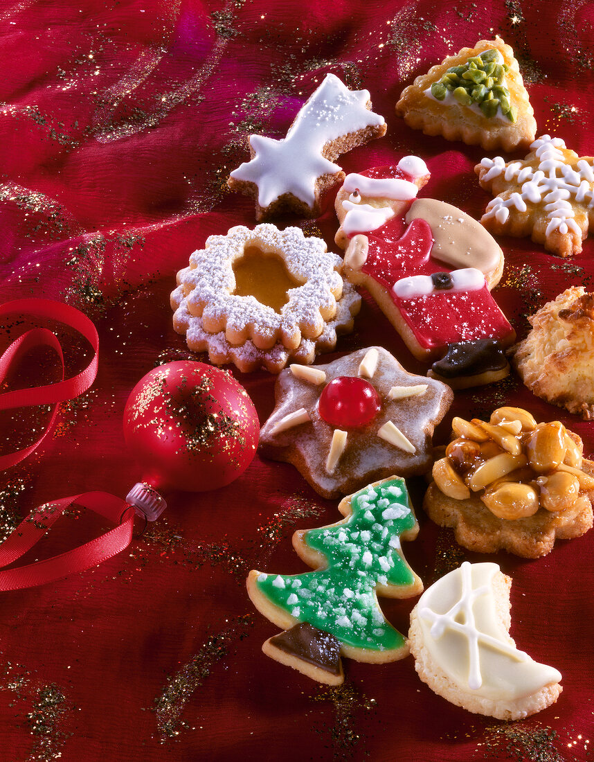 Close-up of Christmas cookies on red tablecloth