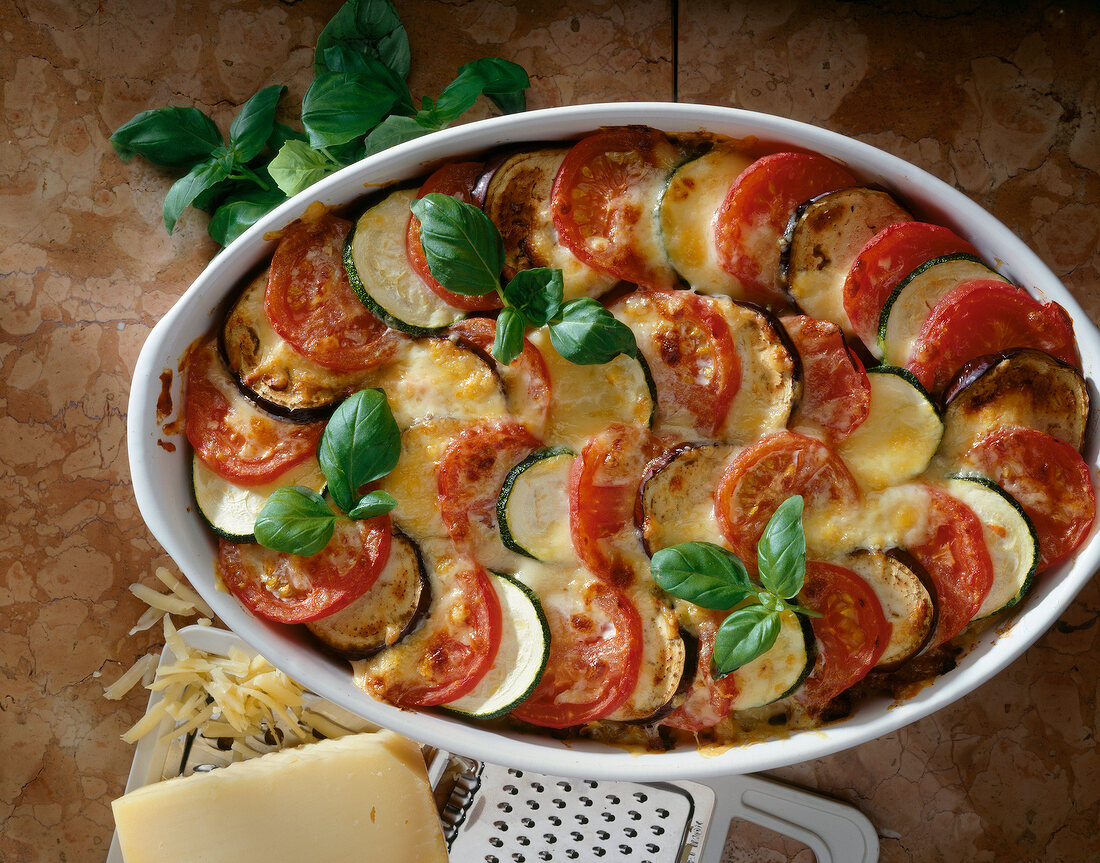 Close-up of zucchini with tomatoes and minced meat in bowl