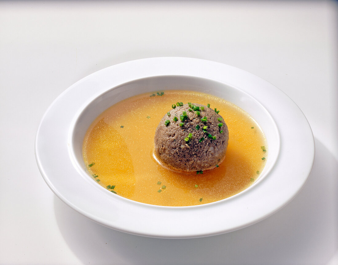 Liver and spleen dumplings in soup on plate