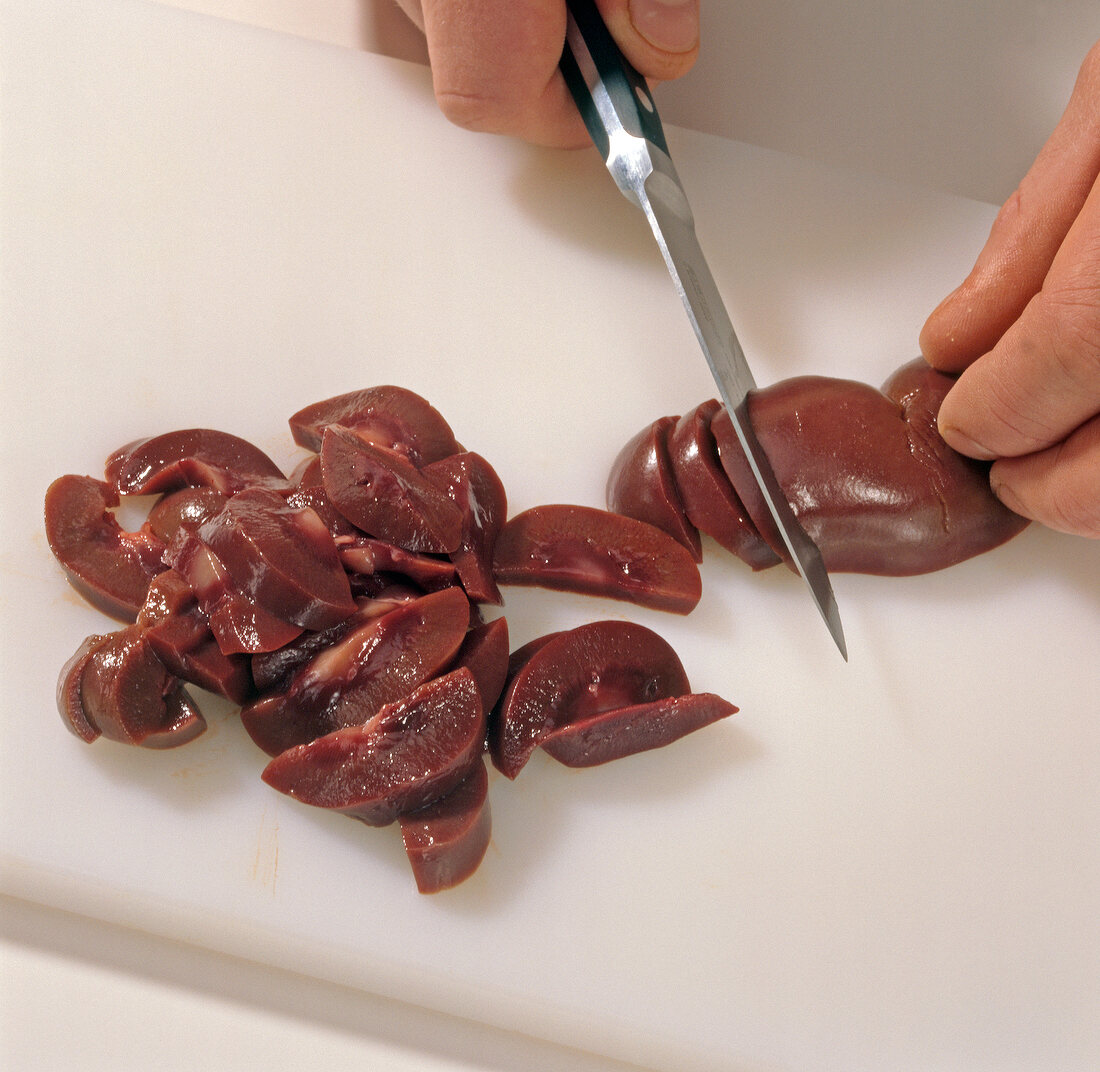 Venison kidneys with mustard chopped on cutting board, step 2