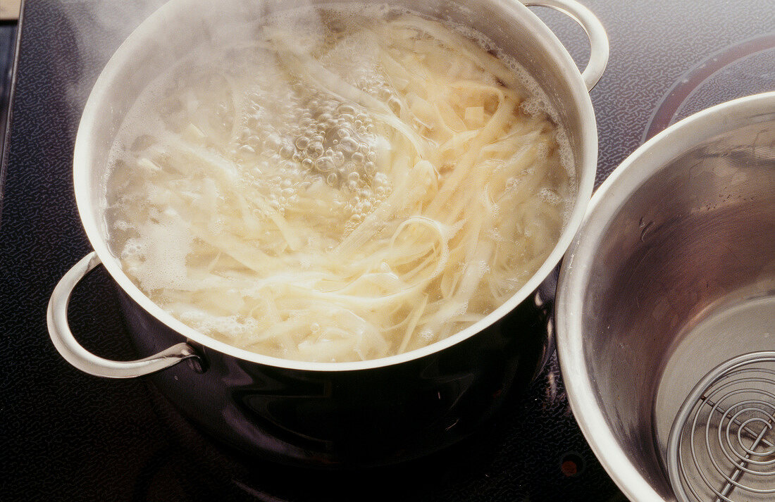 Asparagus being cooked in pot