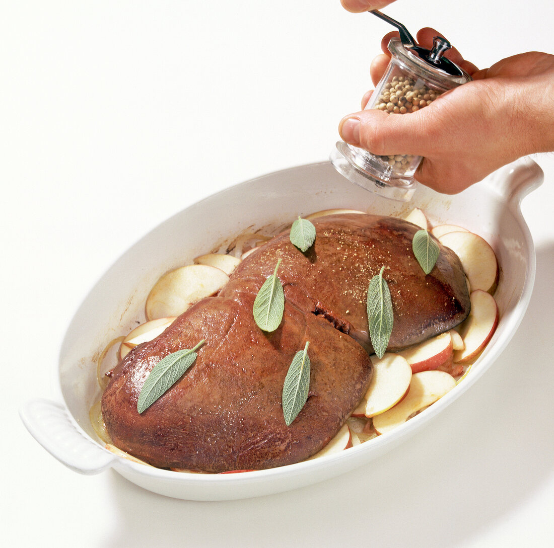 Herbs sprinkled on deer liver in baking dish, step 4