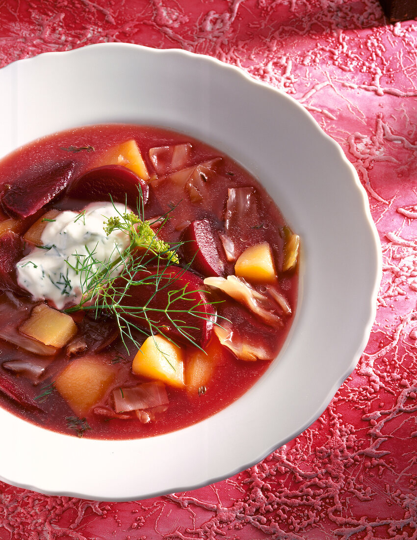 Close-up of beetroot stew with dill in bowl