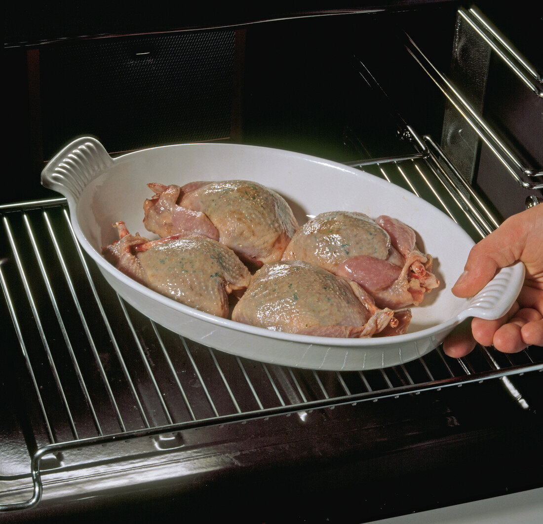 Stuffed quail in baking dish placed in oven, step 11