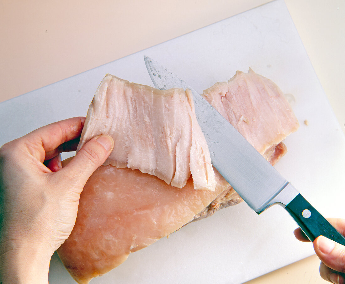 Cutting meat with kitchen knife
