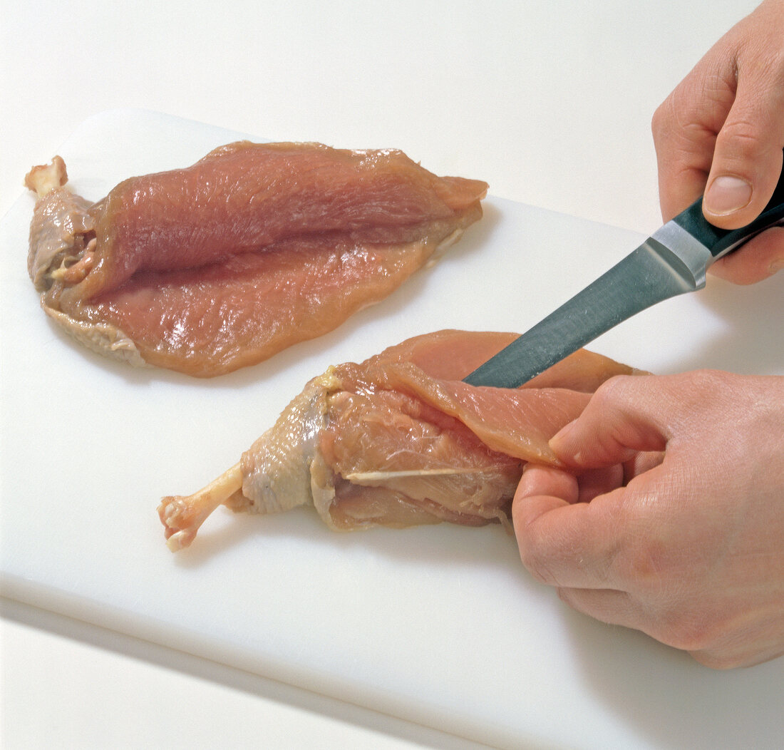 Pheasant breast being cut, step 1