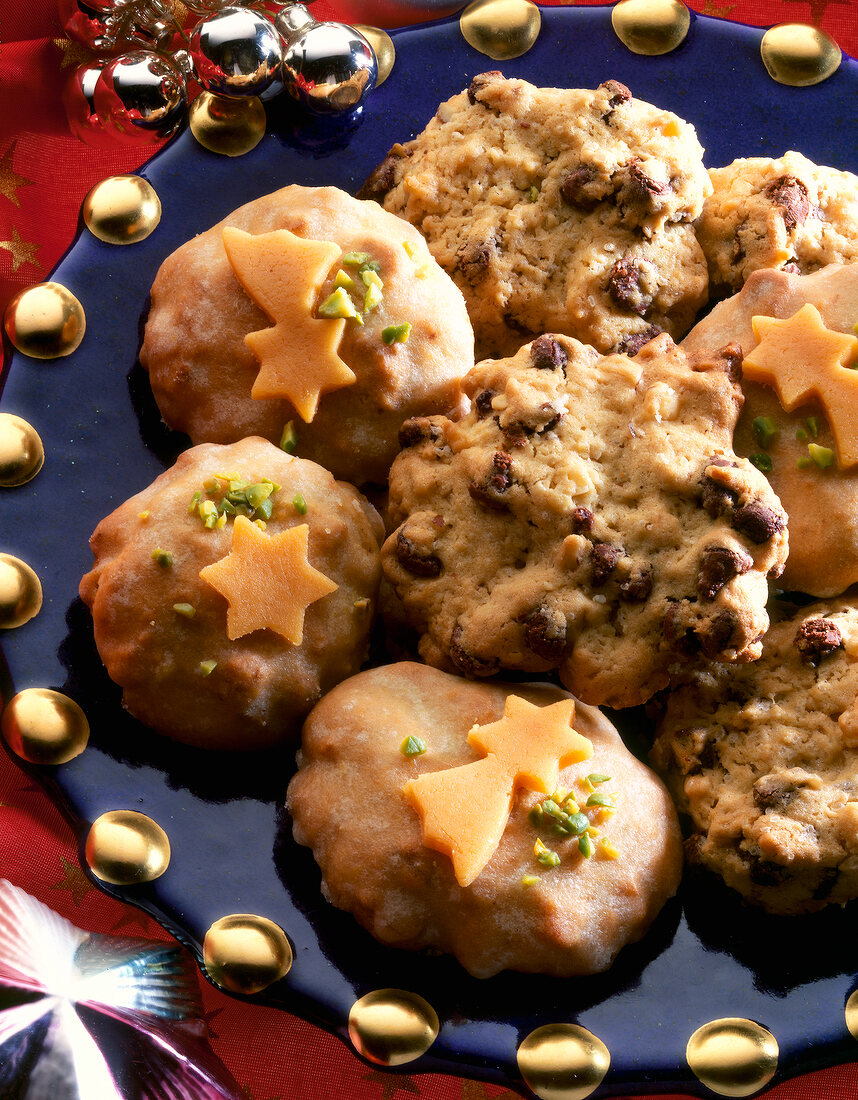 Close-up of walnut cookies with pistachios decorated with marzipan