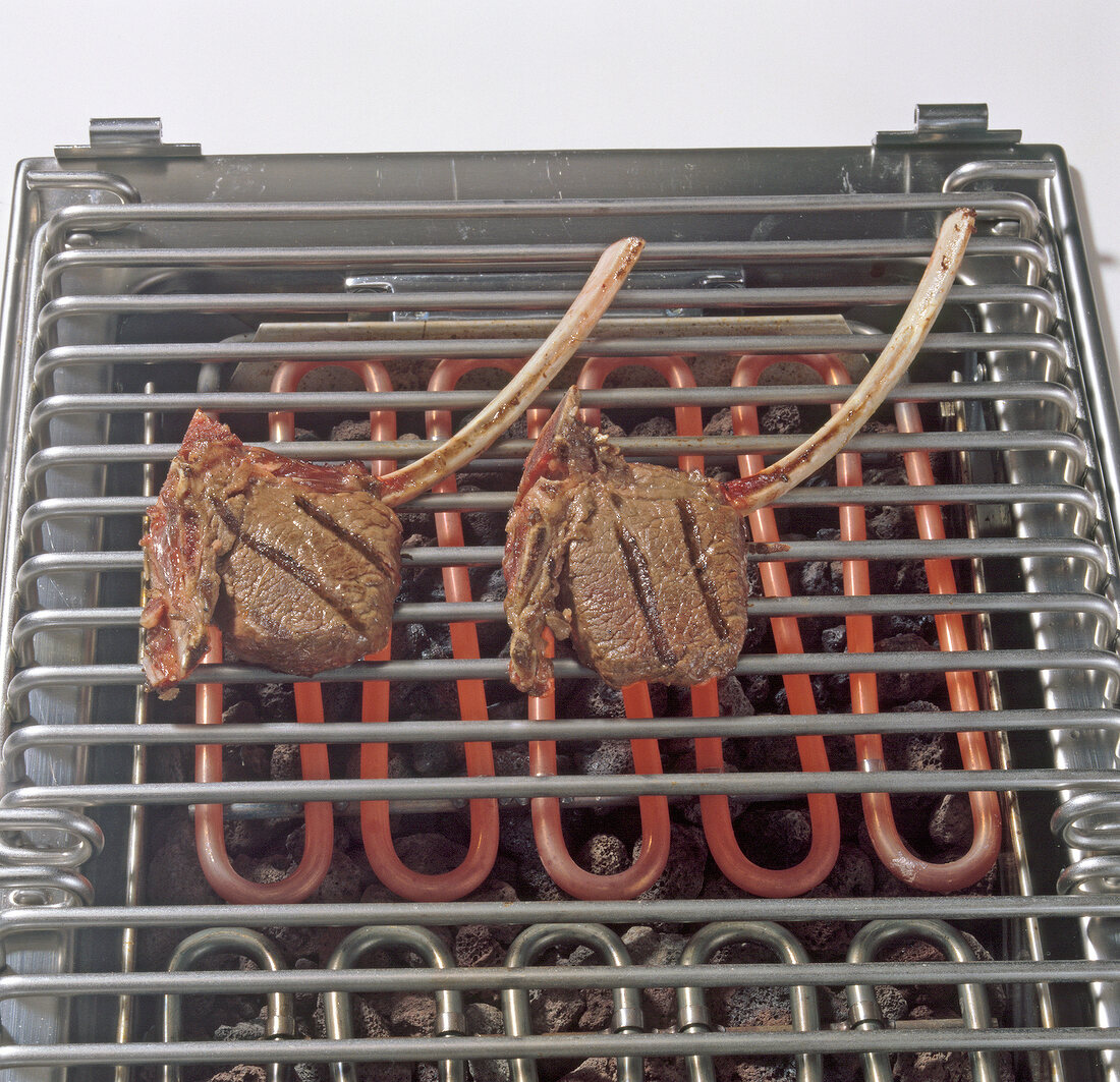 Mouflon chops being grilled on barbecue