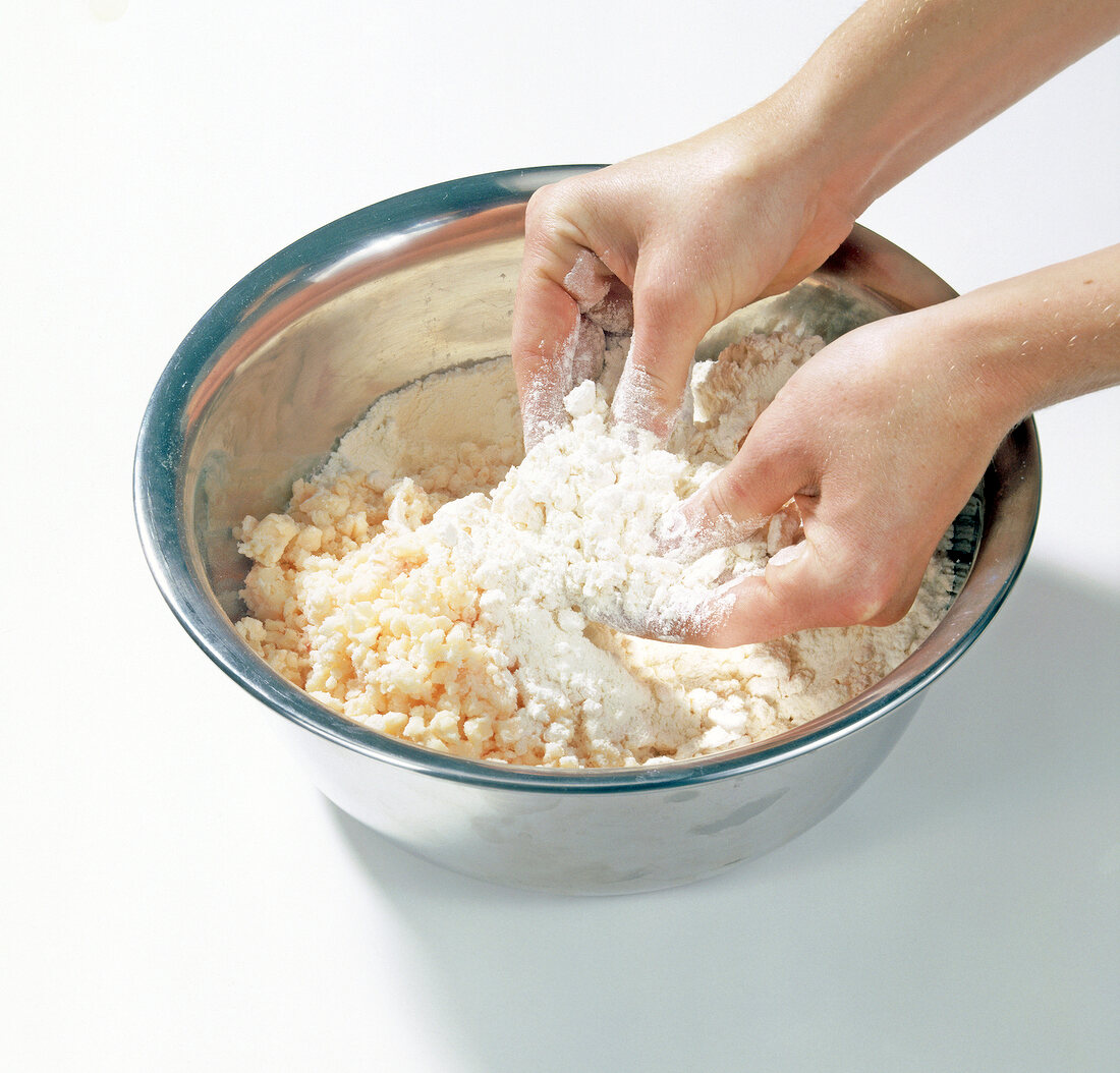 Suet being mixed with flour for preparation of partridge pie, step 2