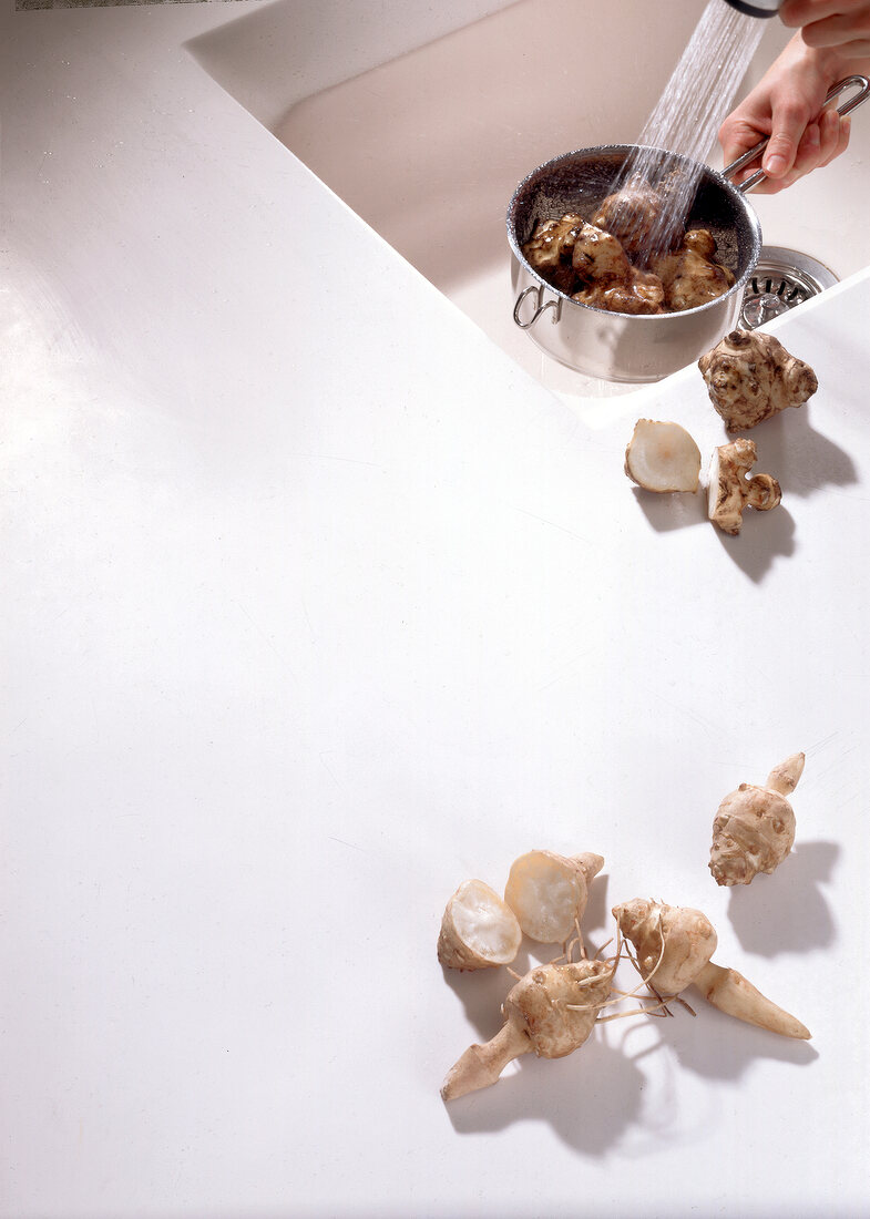 Jerusalem artichoke tubers on white background