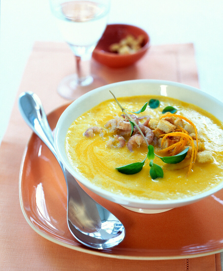 Close-up of pumpkin and orange soup in bowl
