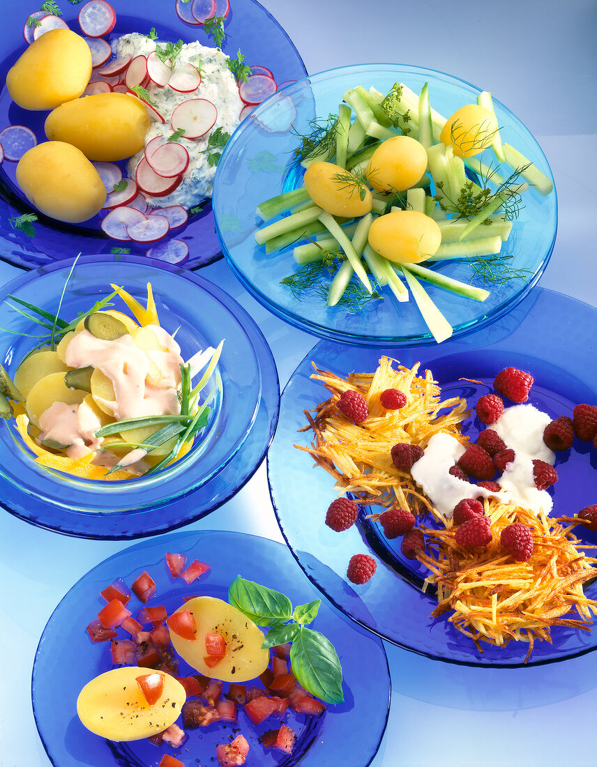 Various vegetables salads on blue plates