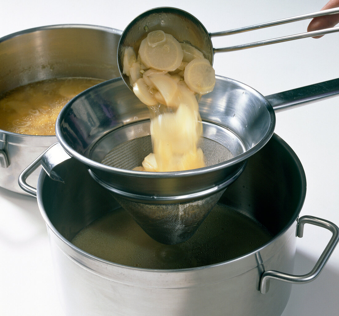 Deglazed siler root being passed through sieve, step 3