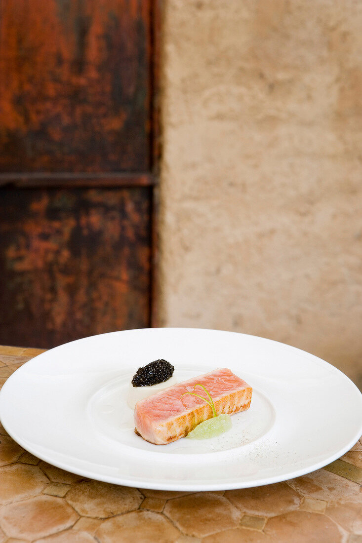 Wild salmon in pepper oil with Aquitaine caviar on plate