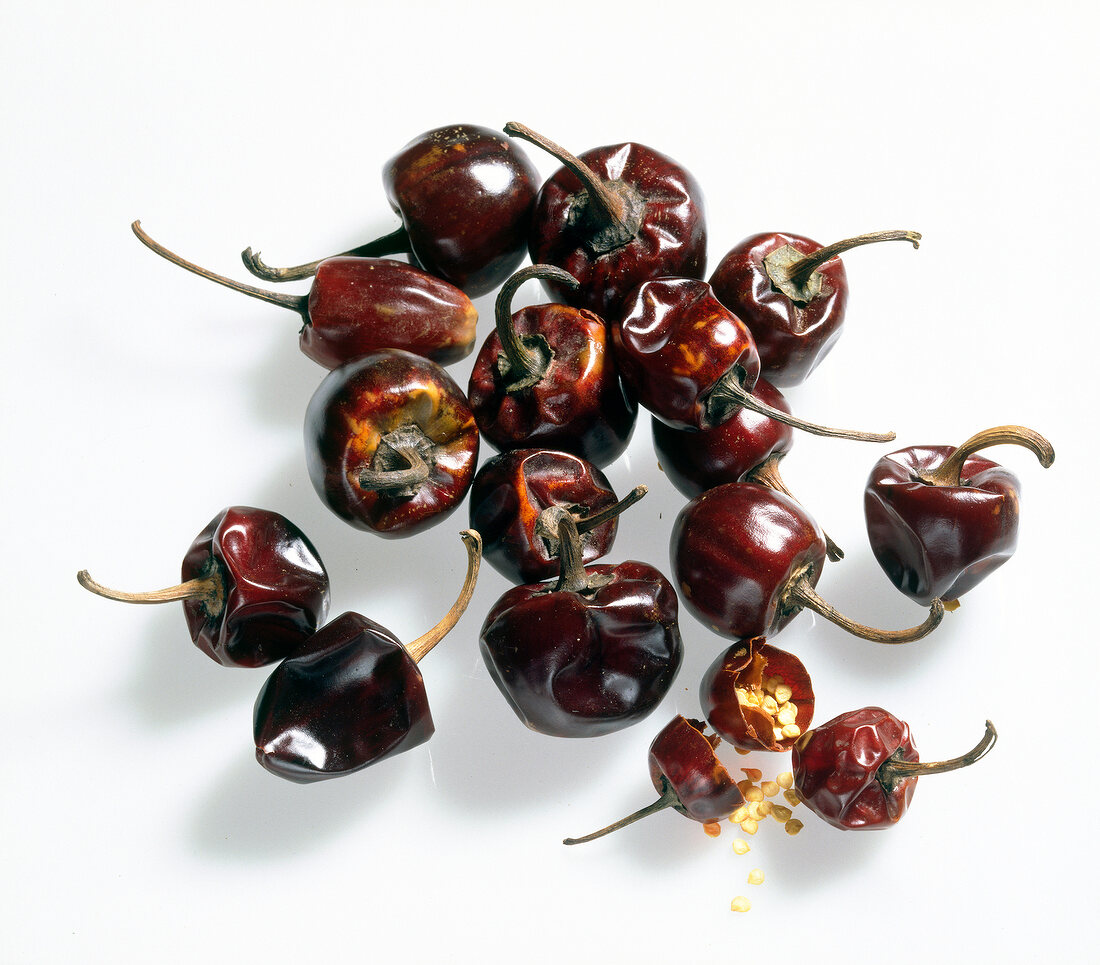 Close-up of chilli cascabel on white background