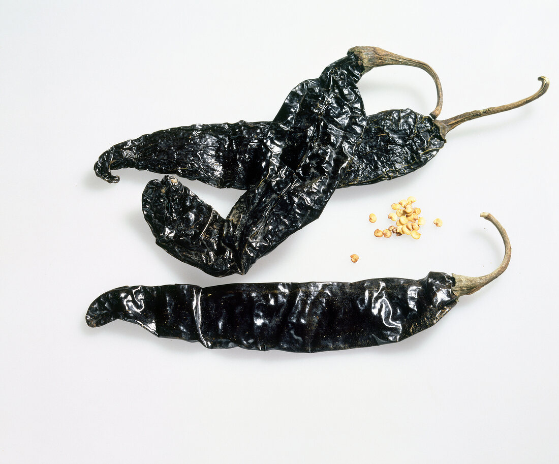 Close-up of chilli pasilla on white background