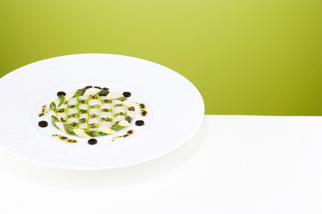 Grid of white and green asparagus on plate