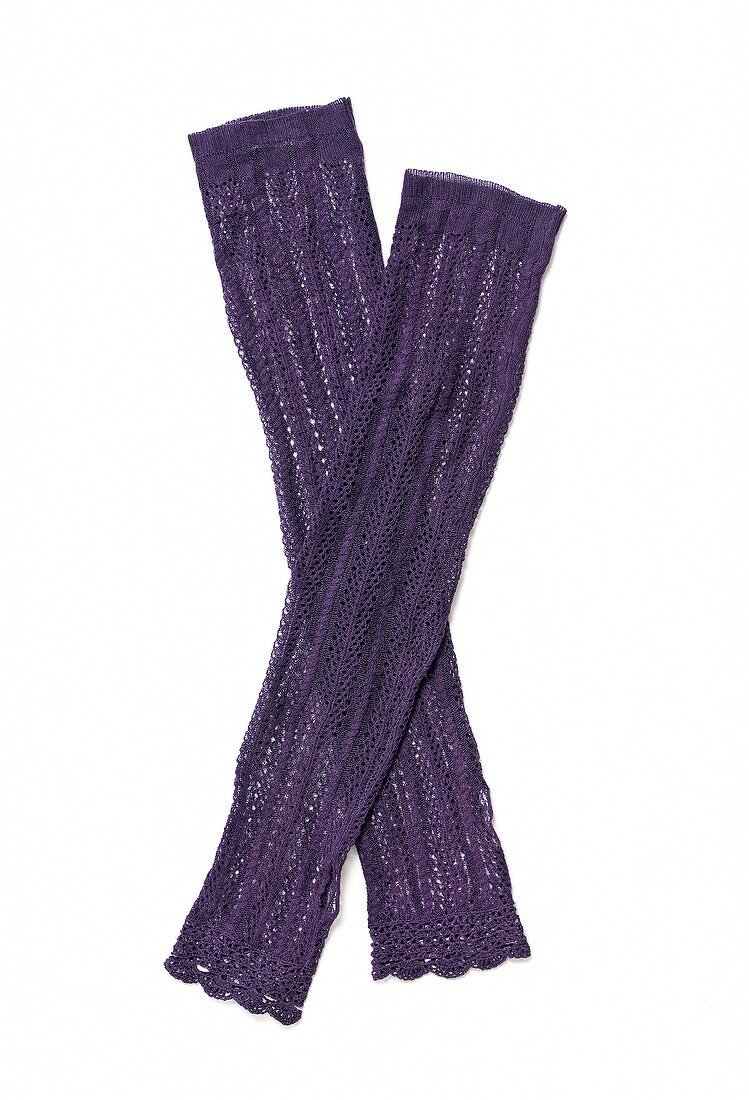 Close-up of purple cuffs on white background