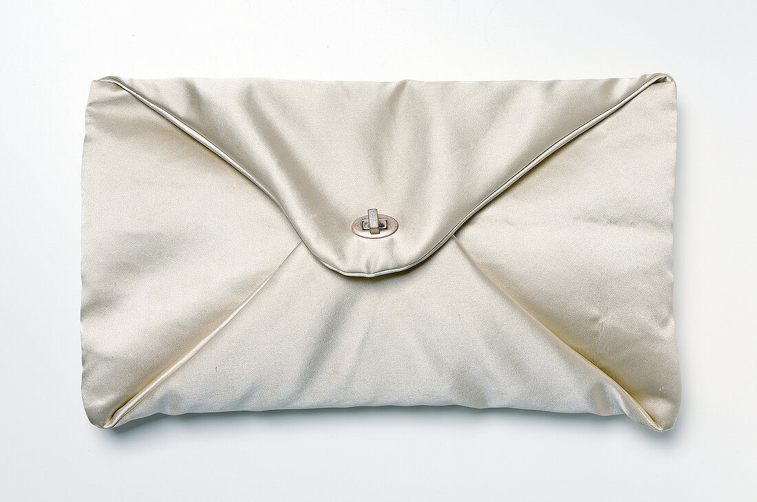 Close-up of silk bag on white background