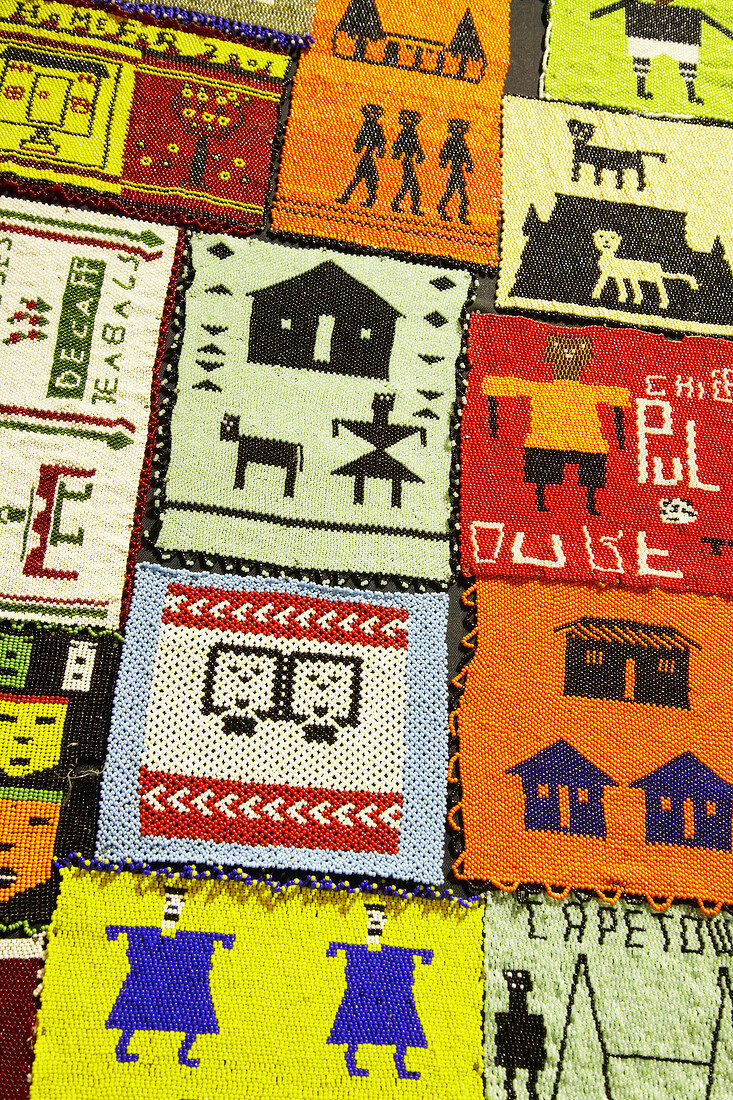 Close-up of quilt with colourful motifs, South Africa