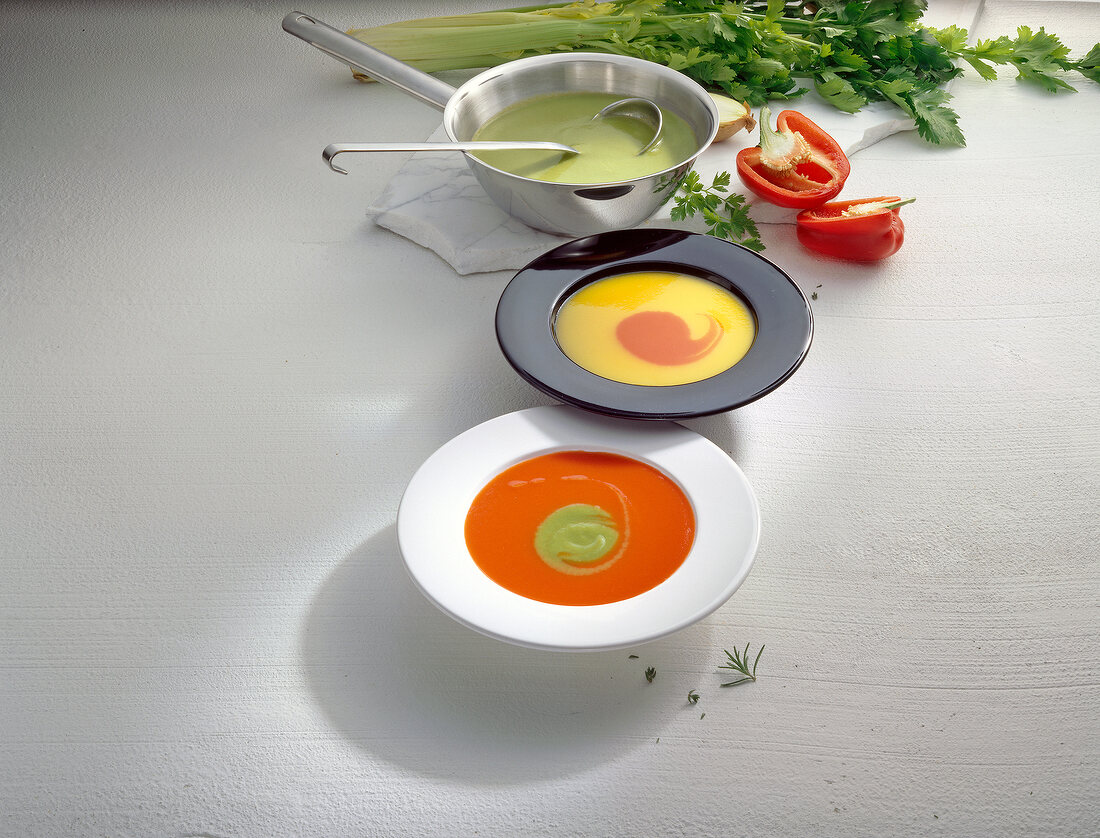 Bowls of different pepper soups 