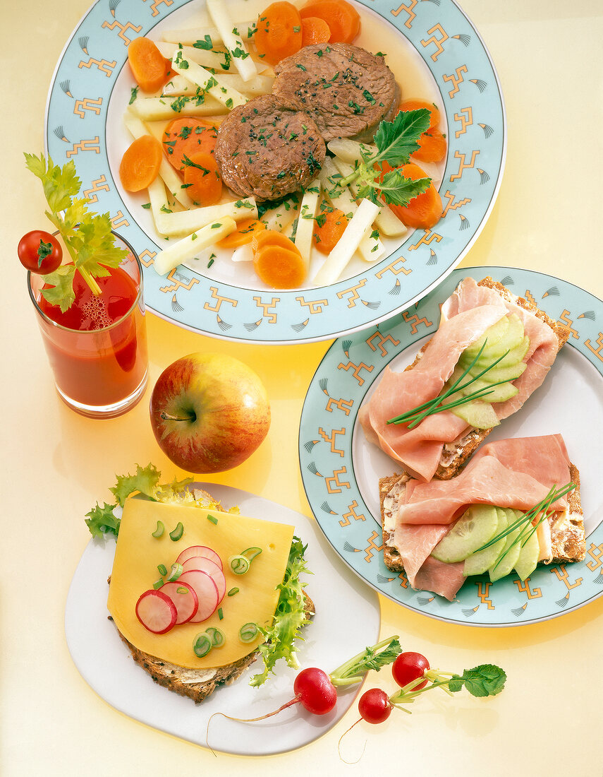 Beef fillet with turnip, apple, juice, ham bread, cheese bread on plate