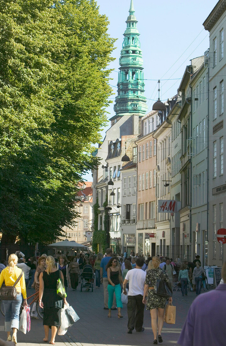 People walking on street near Nicolai Church in Copenhagen, Denmark