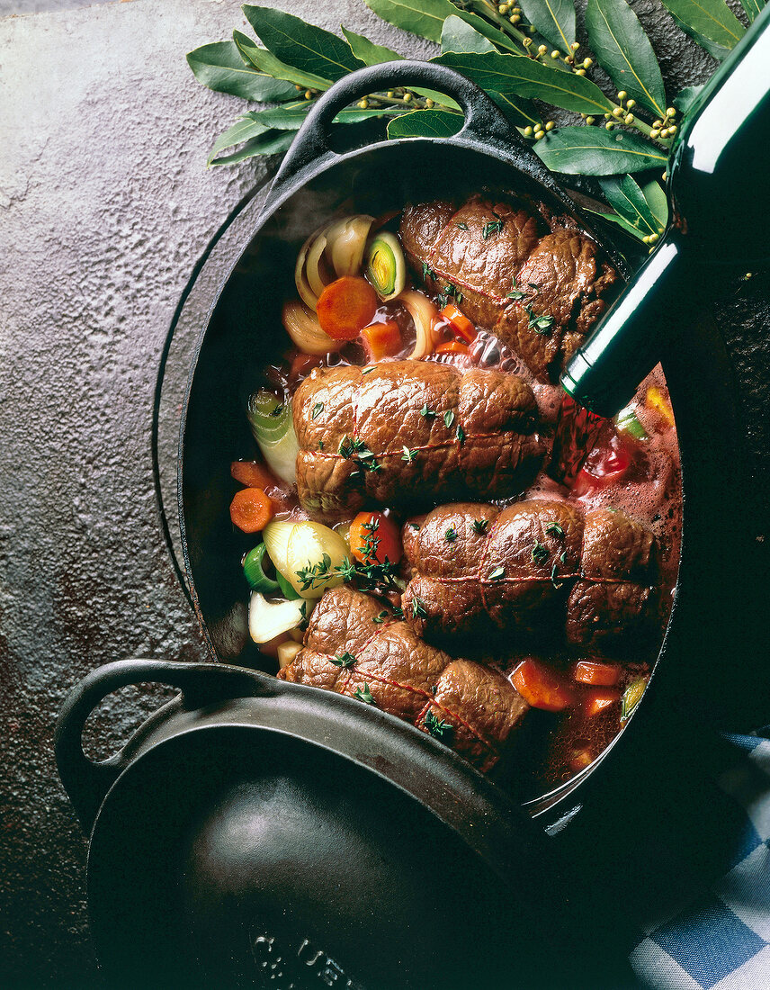 Beef roulade with vegetables in Dutch oven
