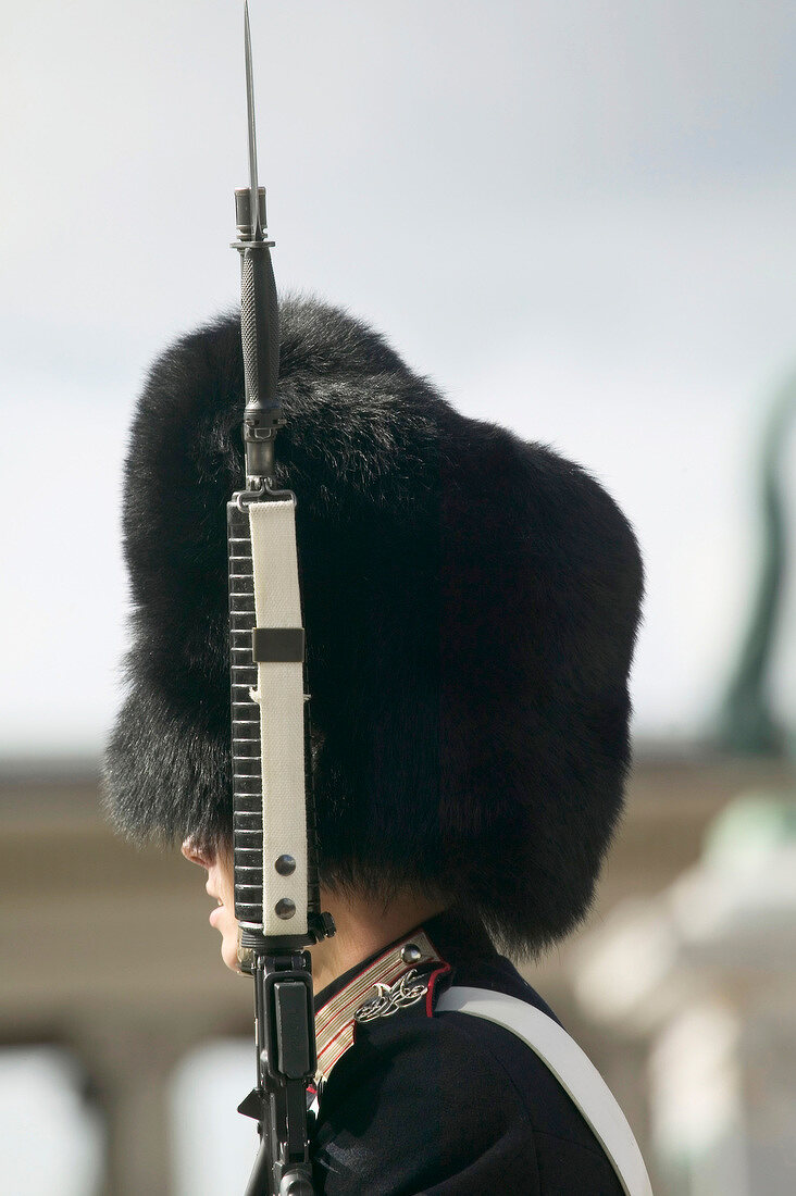 Guard standing with rifle at Amalienborg Palace in Copenhagen, Denmark