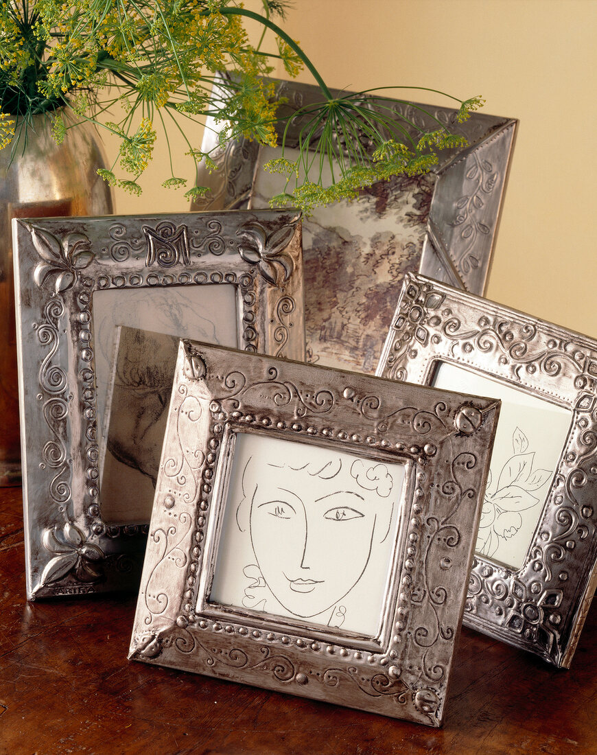 Several picture frames on table