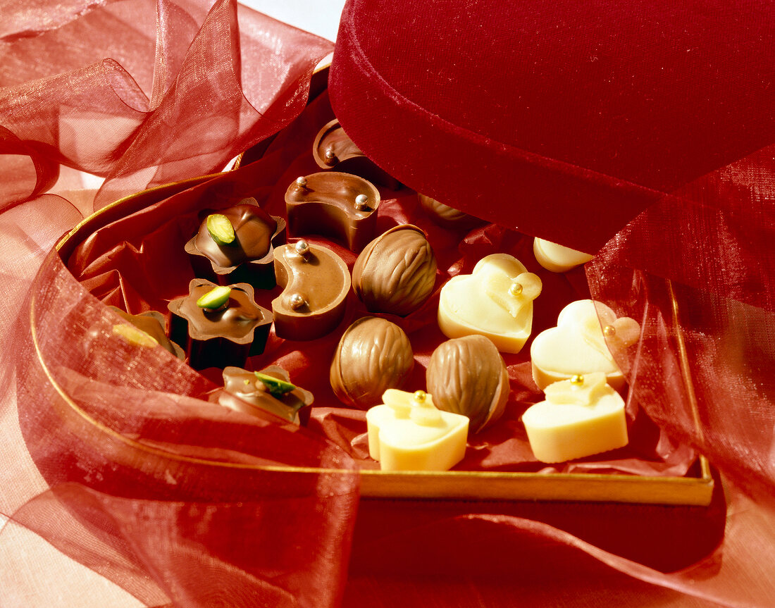 Star, moon and heart shaped chocolates with walnuts and pistachios