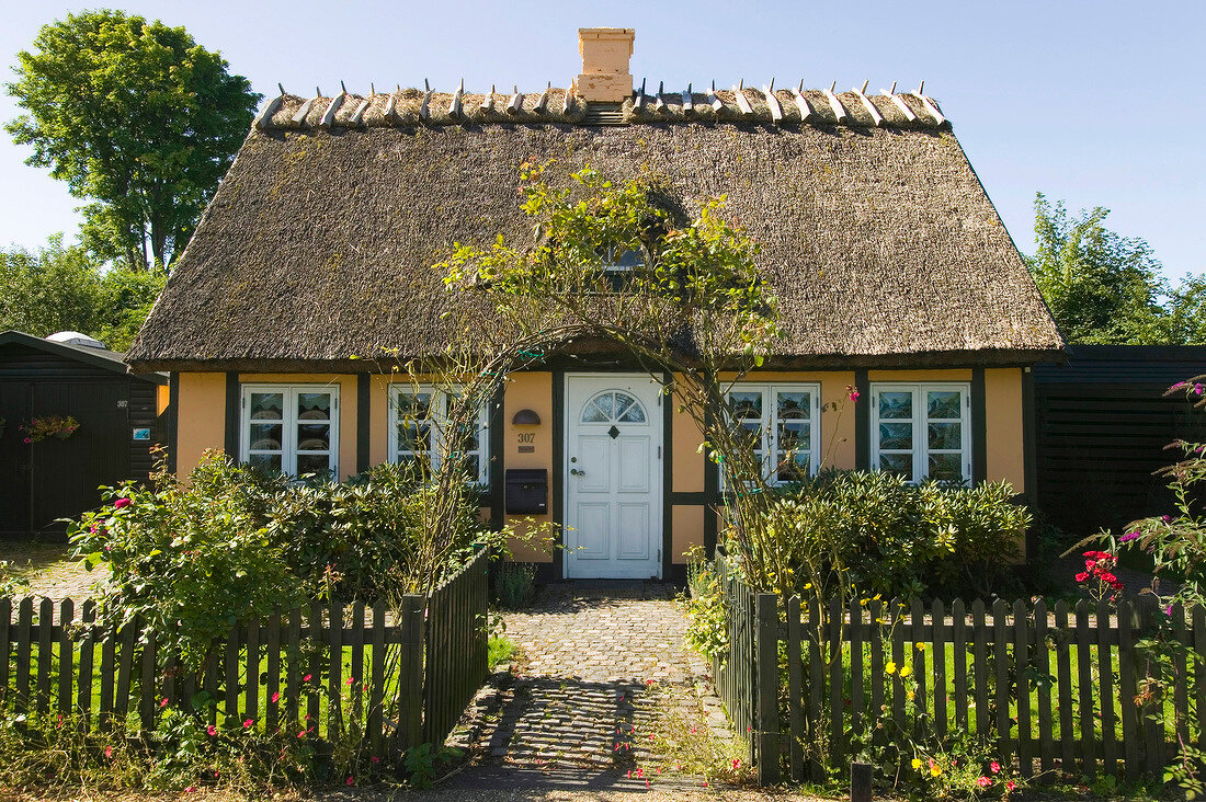 View of thatched yellow cottage in Oresund, Rungsted, Horsholm, Denmark