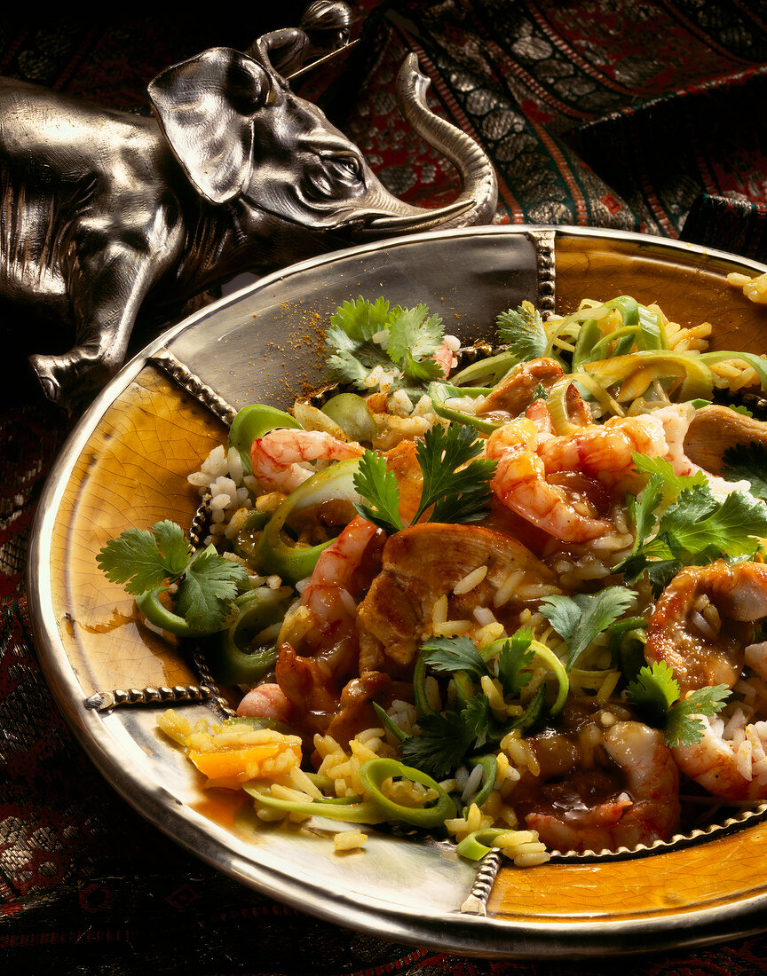 Close-up of Indian rice salad with shrimp and leeks on plate