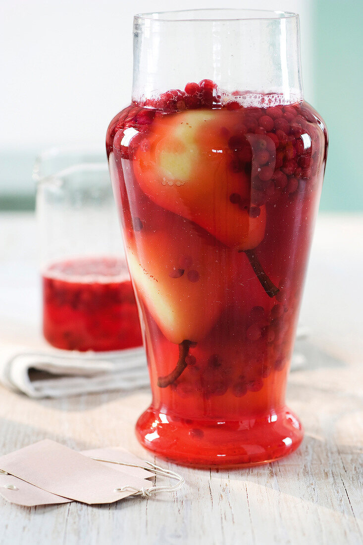 Pears and cranberries stew in glass