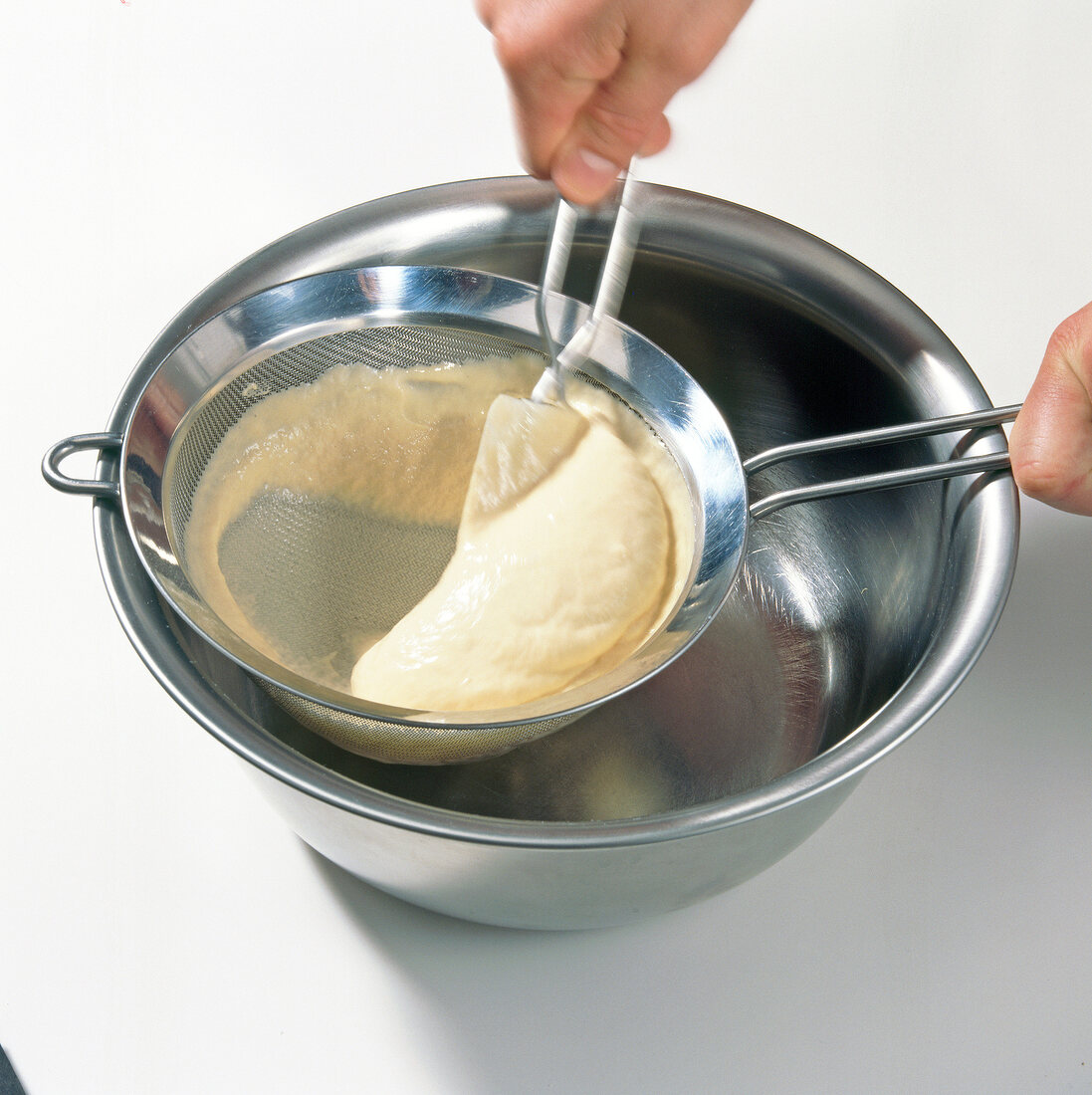 Passing dough through sieve, step 2