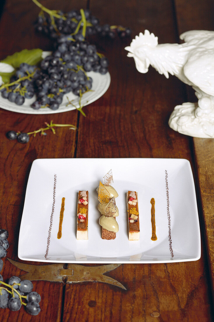 All sorts of banana with ice cream, spices and pumpkin seed oil on plate