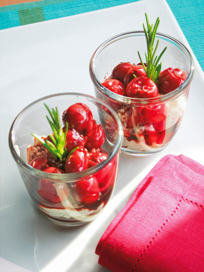 Cherries with ricotta cheese, cinnamon, vanilla and sugar in glasses