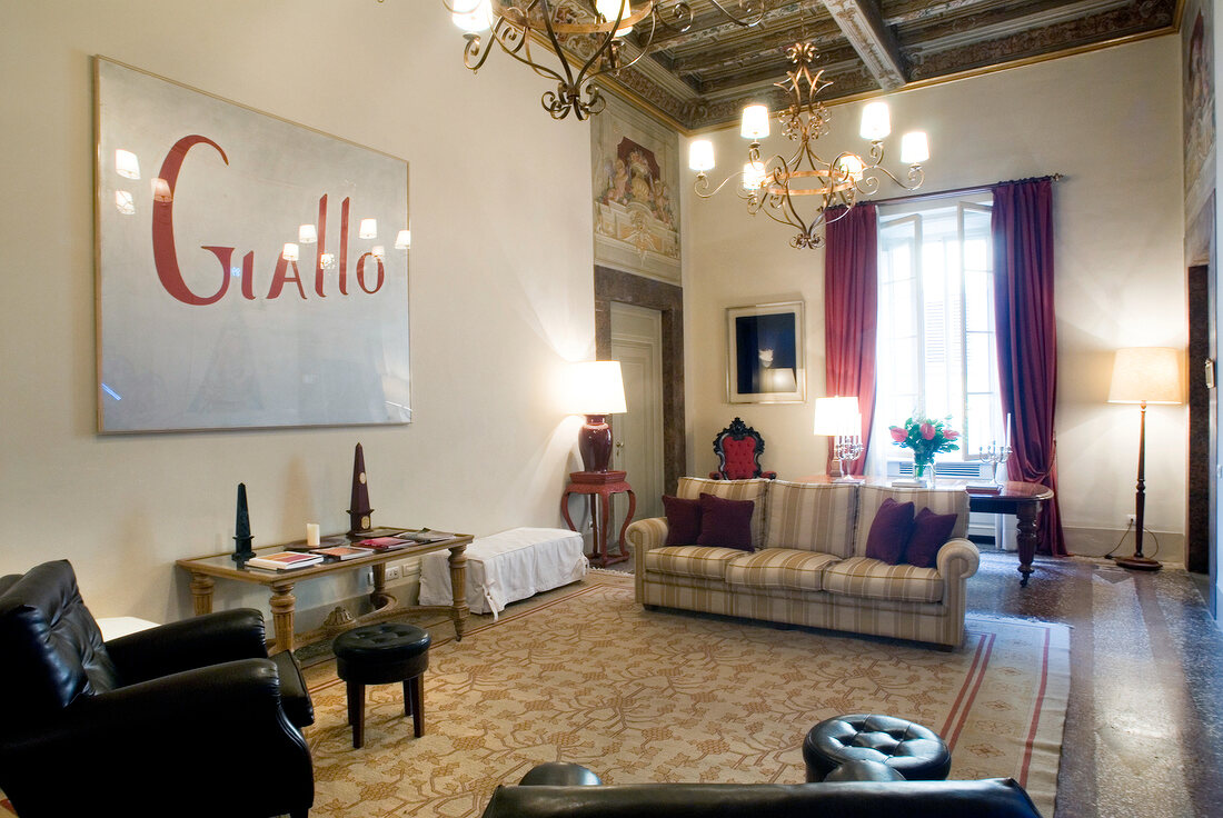 Waiting area with modern art and details of gold in Residenza del Moro, Florence, Italy