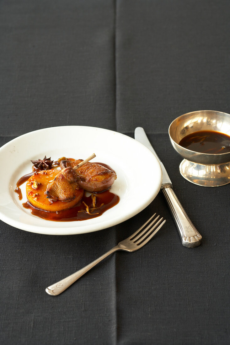 Dove's meat with ginger sauce on plate