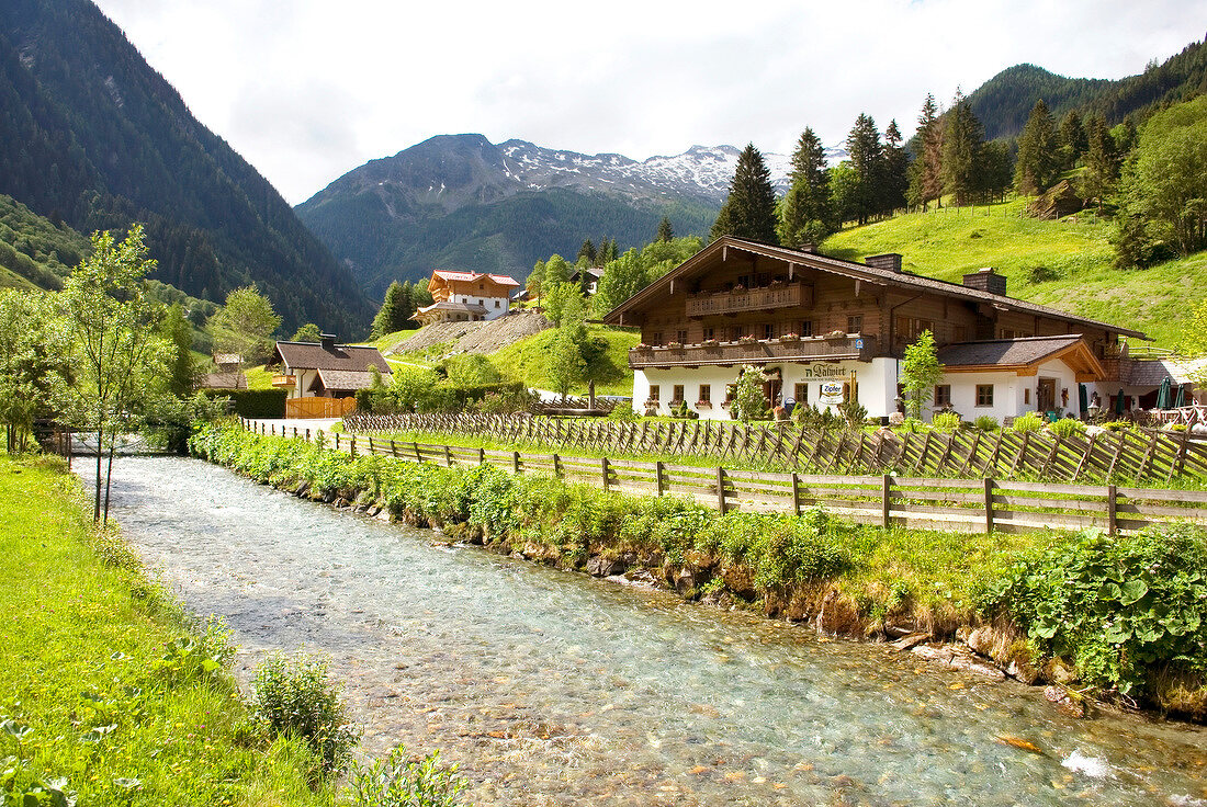 View of guest house with river in Talwirt National Park, Huttschlag, Austria