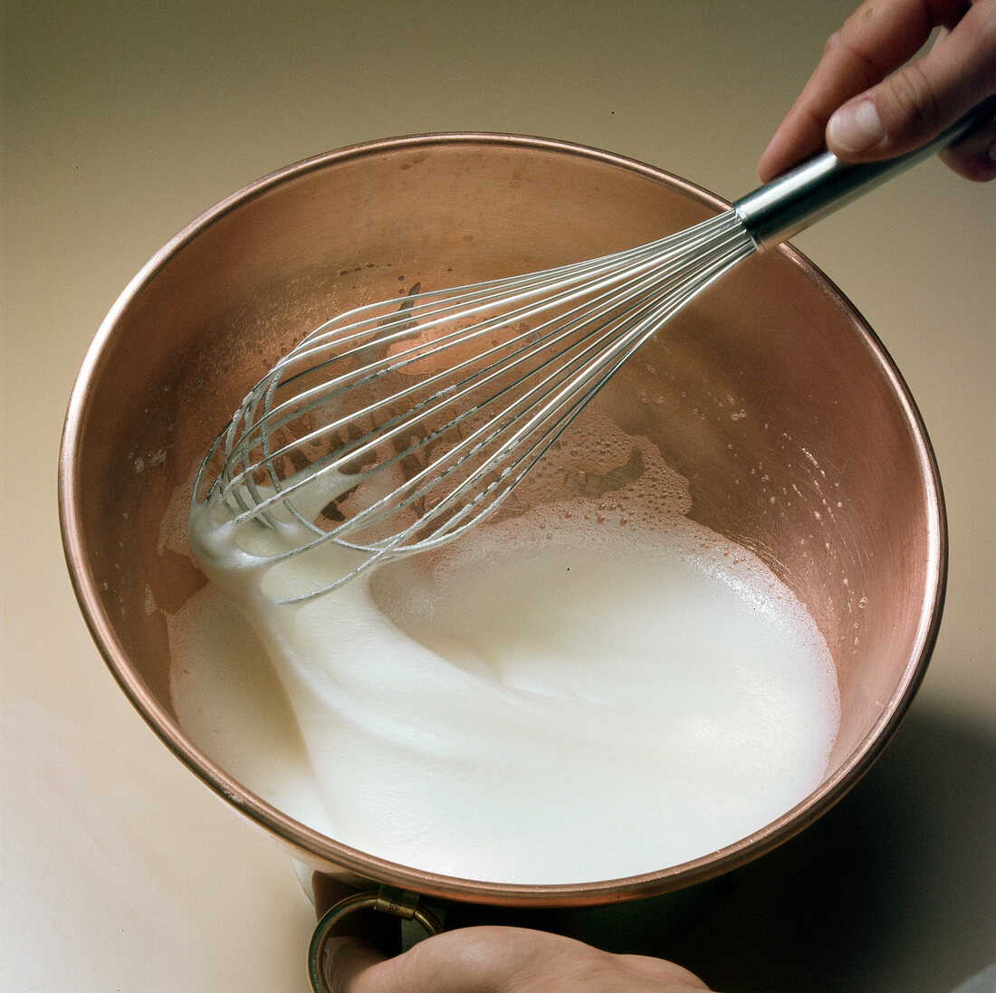 Hand whisking liquid for preparation of meringue, step 2