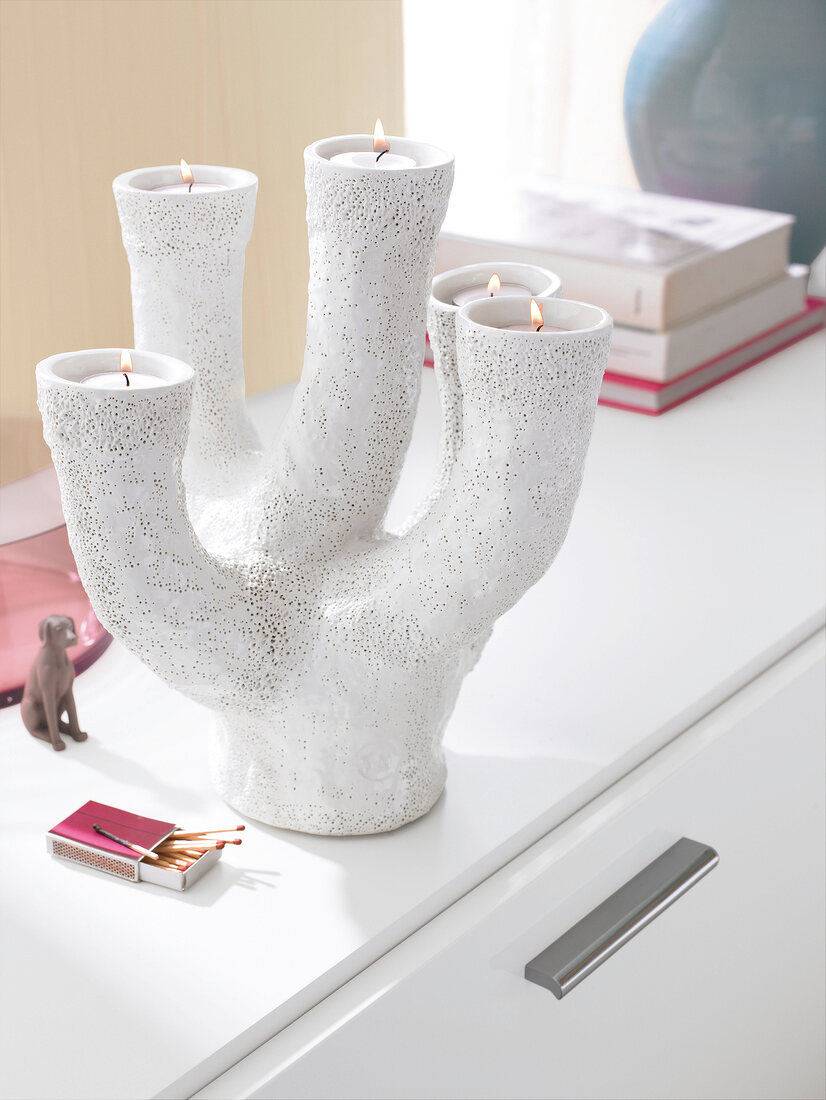 Tea light holder with five arms made of glazed clay in white