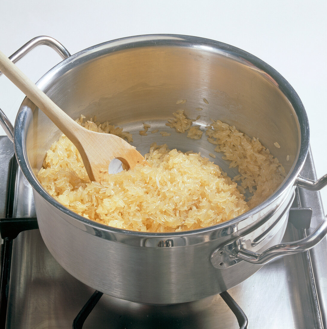 Reis, Langkornreis, Butter im Kochtopf anschwitzen, Step 1
