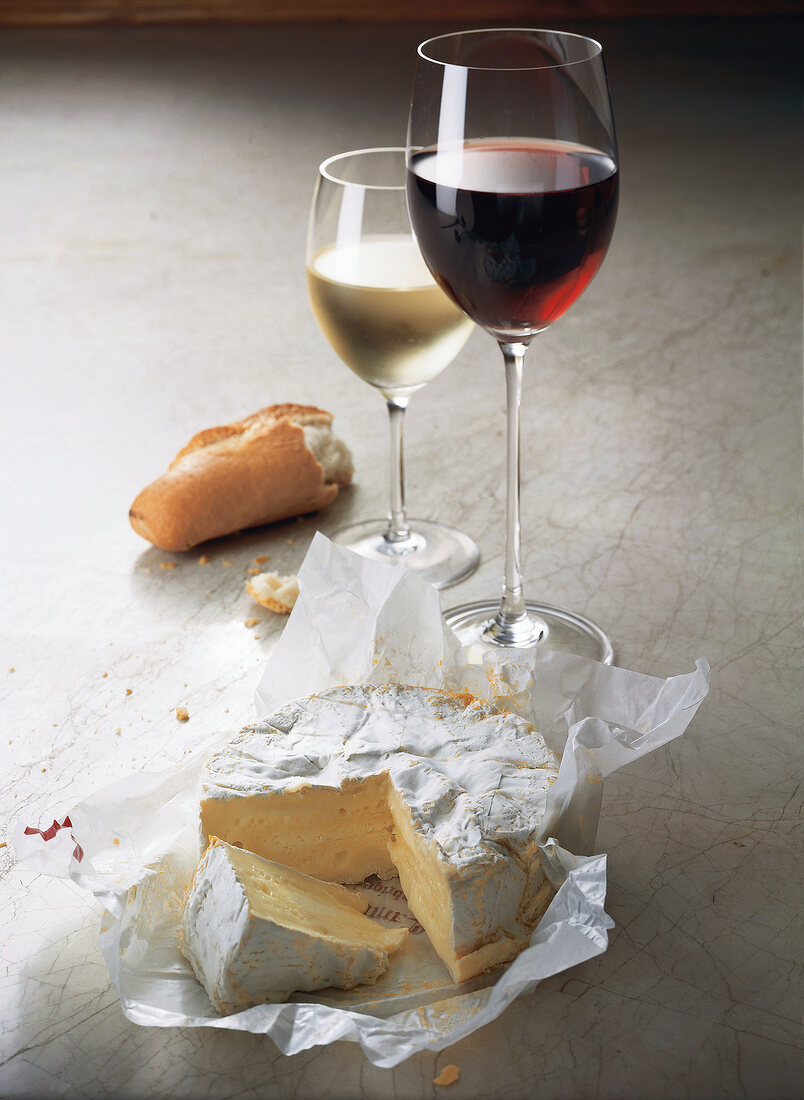 Camembert in paper and wines in glass