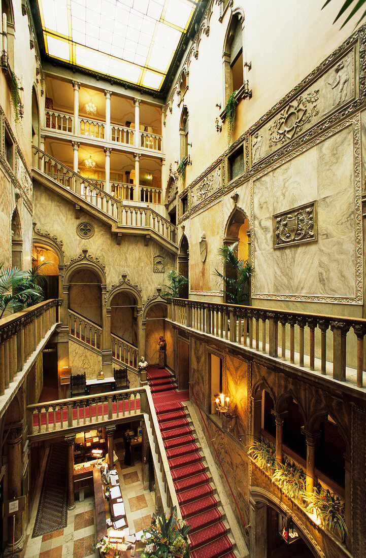 Hall with railings and staircases in Danieli hotel, Venice, Italy
