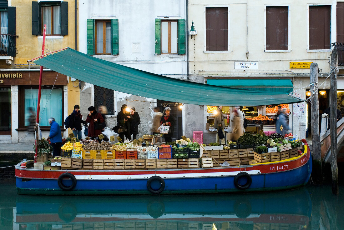 Selling vegetables on ship in canal, Venice