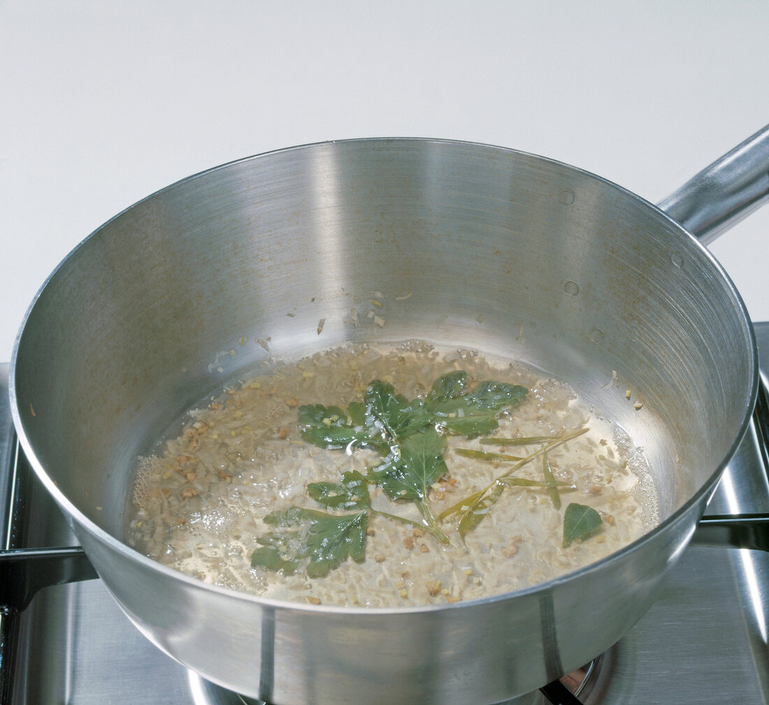 Shallots and herbs in pan, step 3